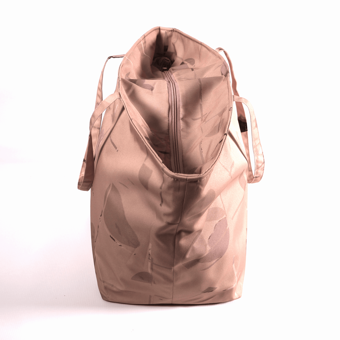 A dusky dark peach carryall bag with a stripe design. Top view closed.