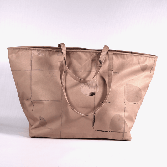 A dusky dark peach carryall bag with a stripe design.