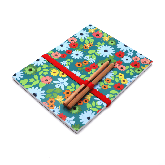 A4 Sketchpad with pencils and pencil holder in bright daisy floral design on a blue background. Side binding.