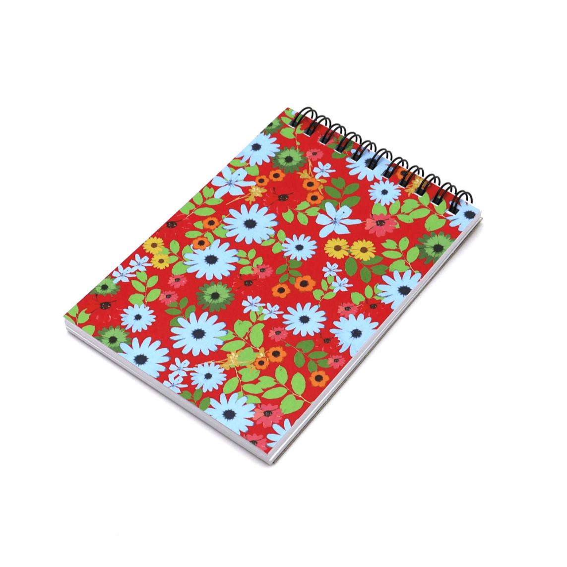 A6 Notebook with bright daisy floral design on a red background. Top wire binding.