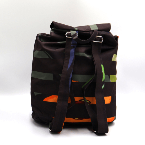 Lightweight backpack with drawstring and bright daisy floral and stripe design on dark brown/black background. Back view.