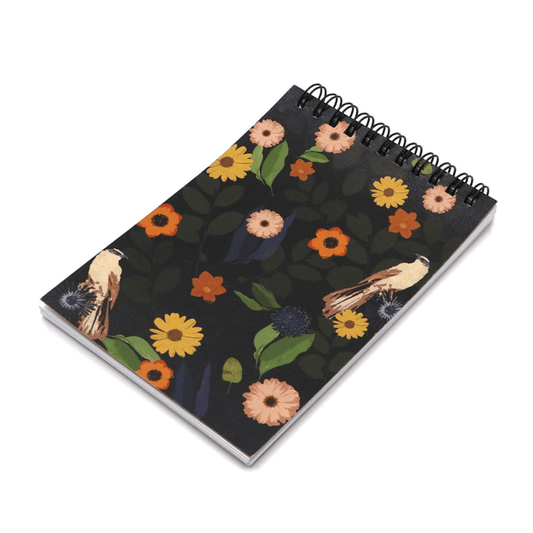 A6 Notebook with bright daisy design on a black background. Top wire binding.