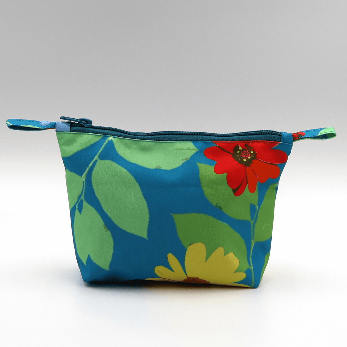 Ellie B Blue Darling makeup bag, colorful floral design, zipped closure, handmade, perfect for organizing beauty products.