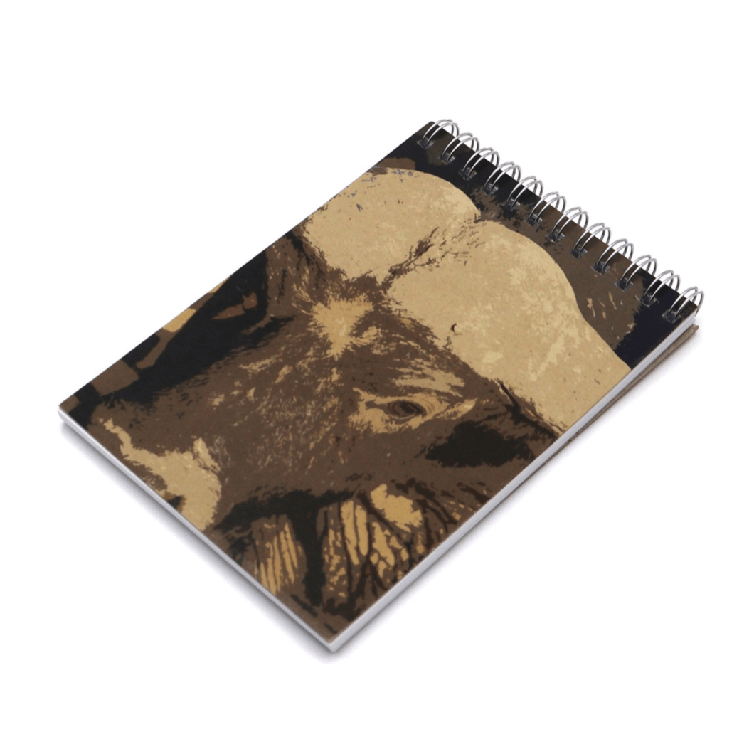 A6 notebook with buffalo face in brown and ivory on cover. Top binding.