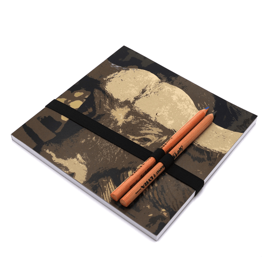 Square art pad with pencils and pencil holder with buffalo face in brown and ivory on cover.