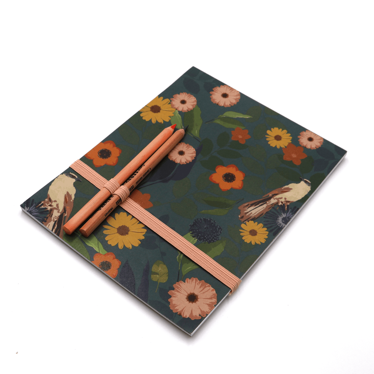 A4 Sketchpad with pencils and pencil holder with bright daisy floral design on dark green background.