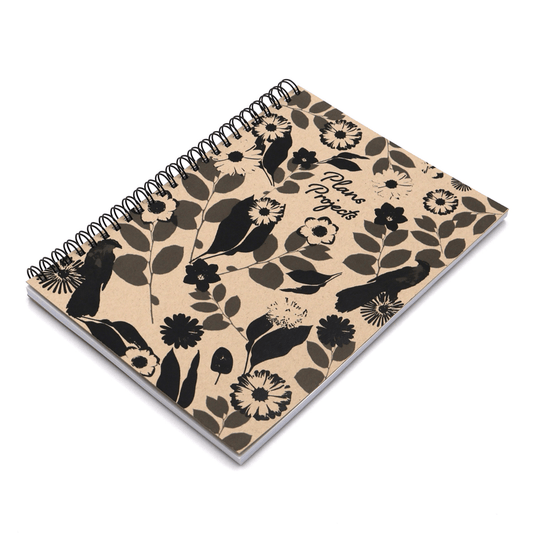 A5 Journal with daisy floral design in black on a beige sand background.
