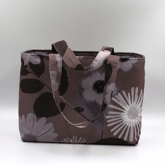 Teacher/book bag with light grey and mauve floral design on a dark mauve background. Carry books and crafts.