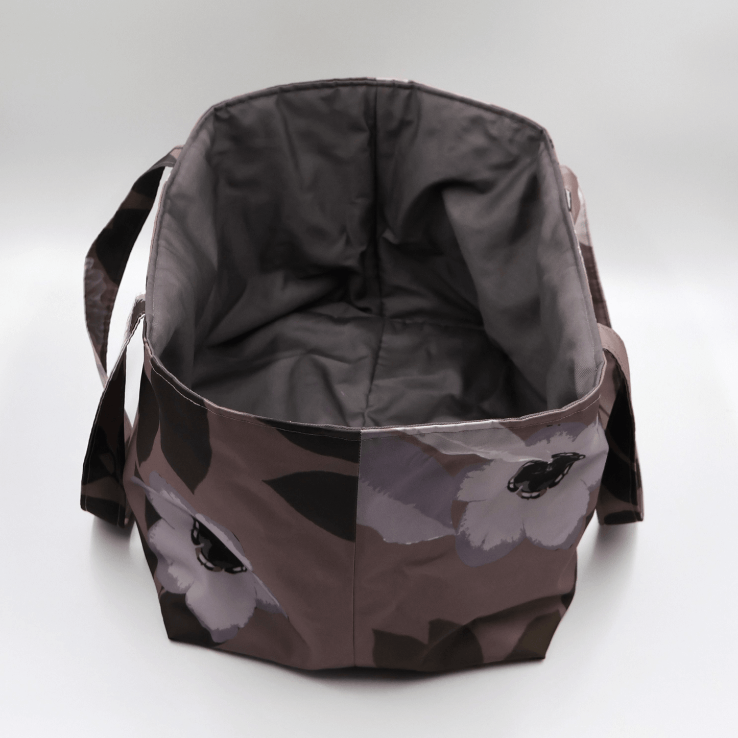 Large Teacher/book bag with light grey and mauve floral design on a dark mauve background. Without plastic inner.