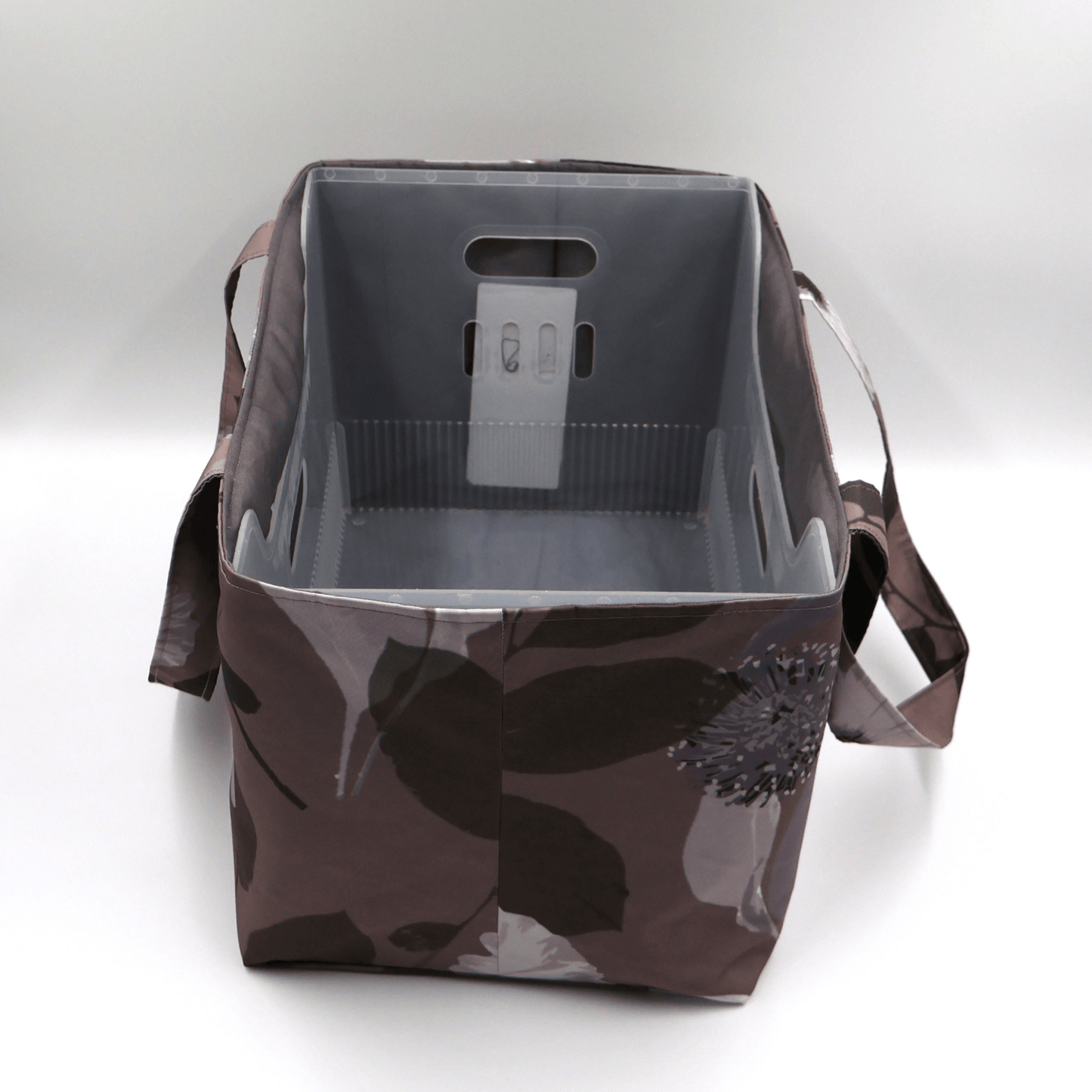 Large Teacher/book bag with light grey and mauve floral design on a dark mauve background. With plastic inner.