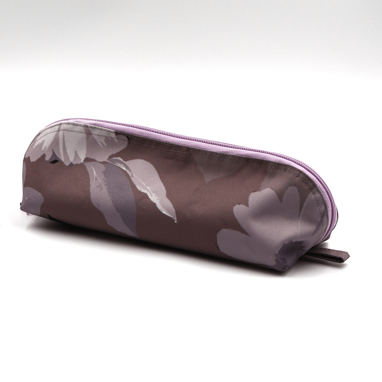 Pencil bag in soft mauve and dark grey daisy floral design on dark mauve background. Side view.