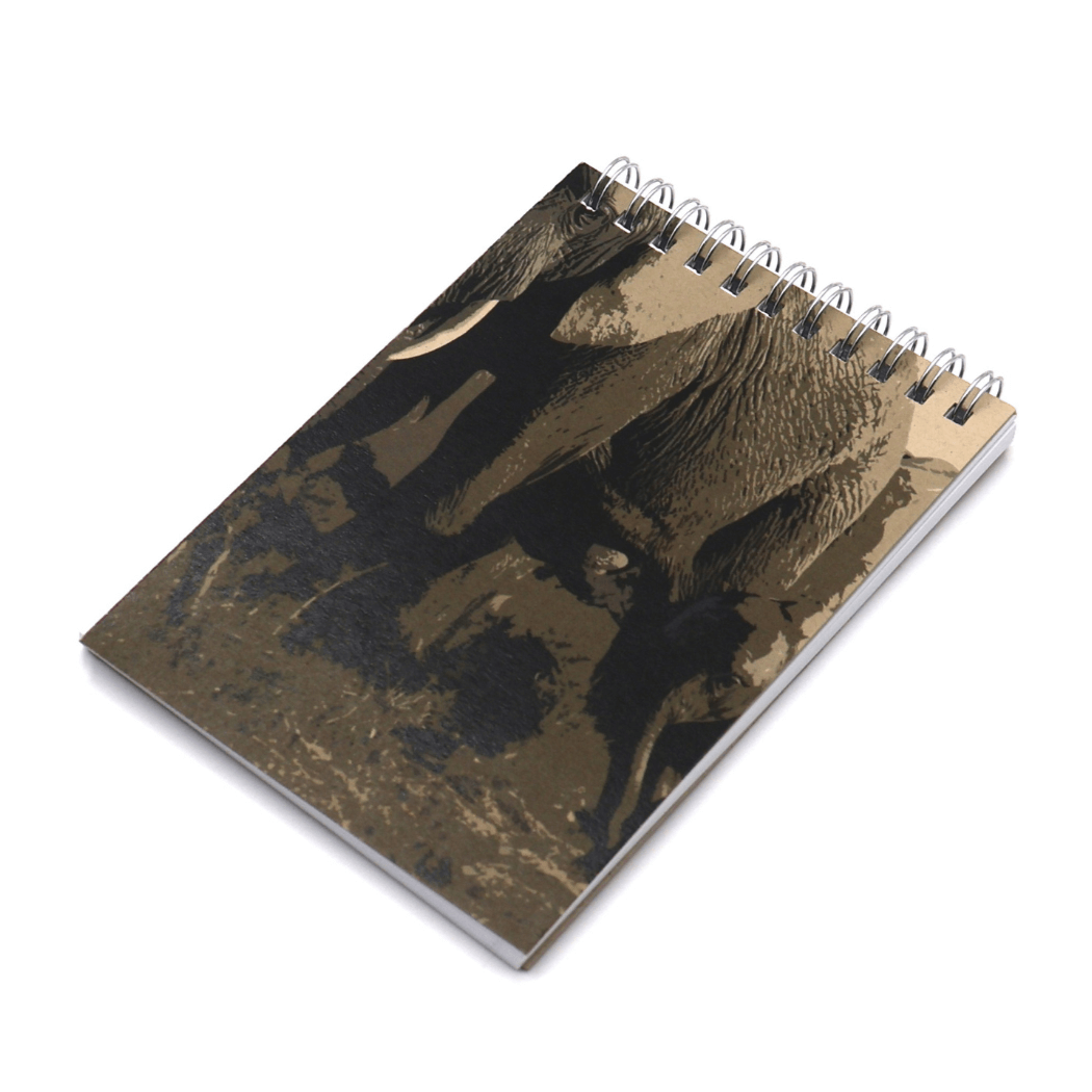 A6 Notebook with elephant family design in brown on a beige/sand background. Top binding.