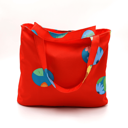 Shoulder bag with bright daisy floral design on a red background. Perfect for carrying books and documents.