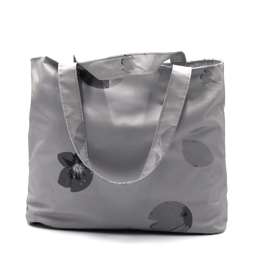 Shoulder bag with daisy floral design in dark and light grey. Perfect for carrying books and documents.