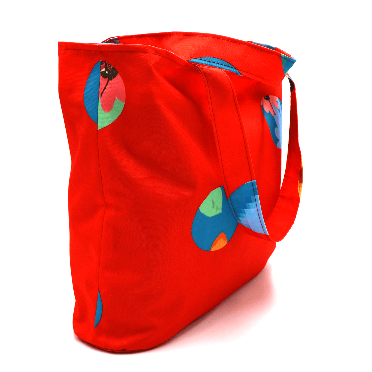 Shoulder bag with bright daisy floral design on a red background. Perfect for carrying books and documents. Side view