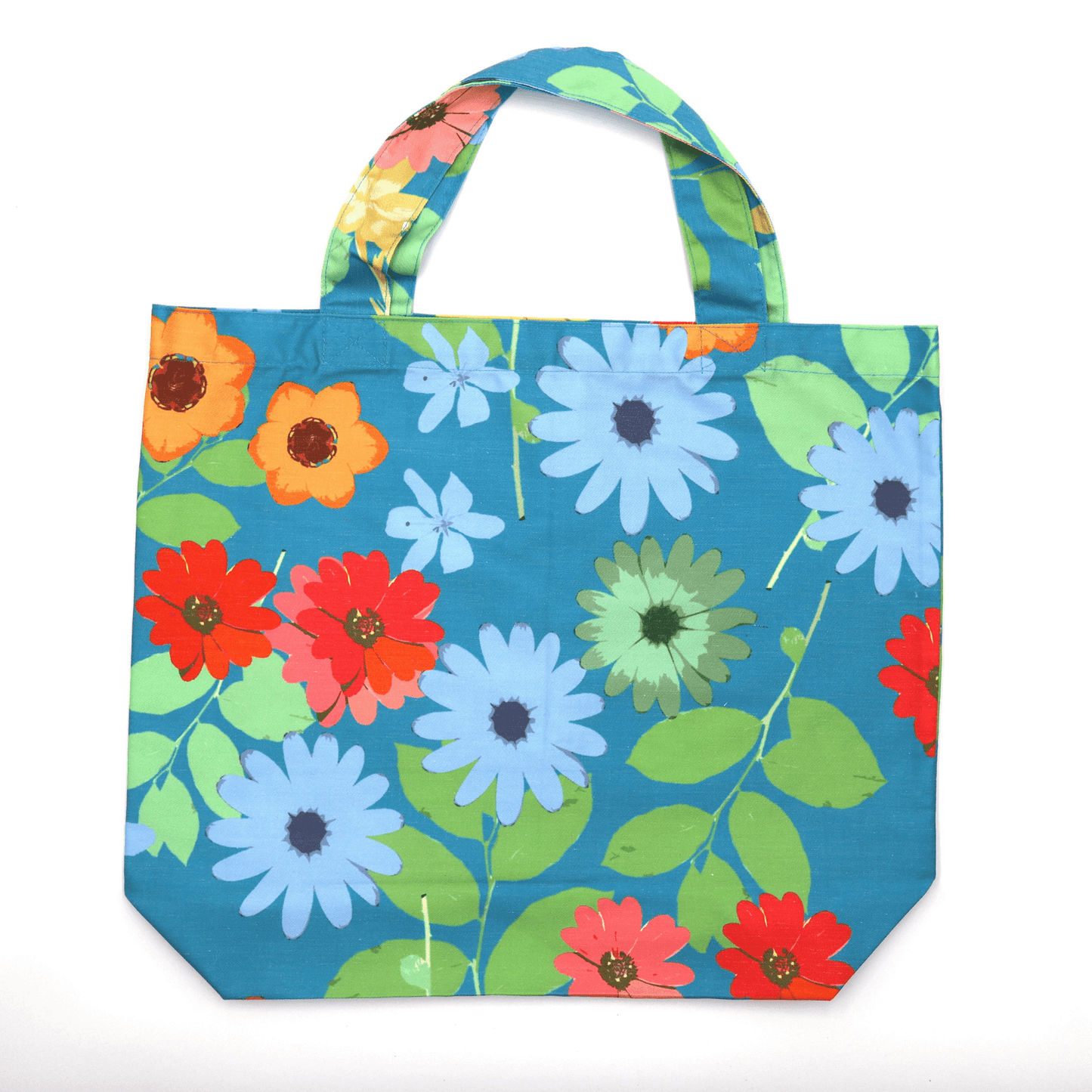 A bright, beautiful tote bag with Daisy design on a blue background. Perfect finishes. Flat view.