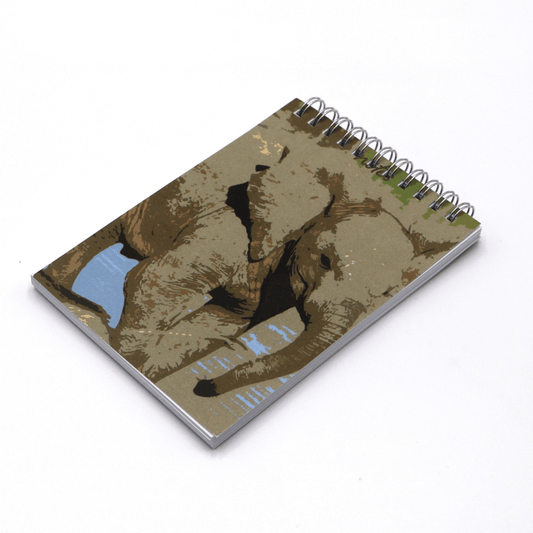 A6 Notebook with pencils and pencil holder with baby elephant design on light blue background.