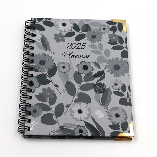 A5 Daily planner with dark and light grey floral design on a soft grey background. Hard cover.