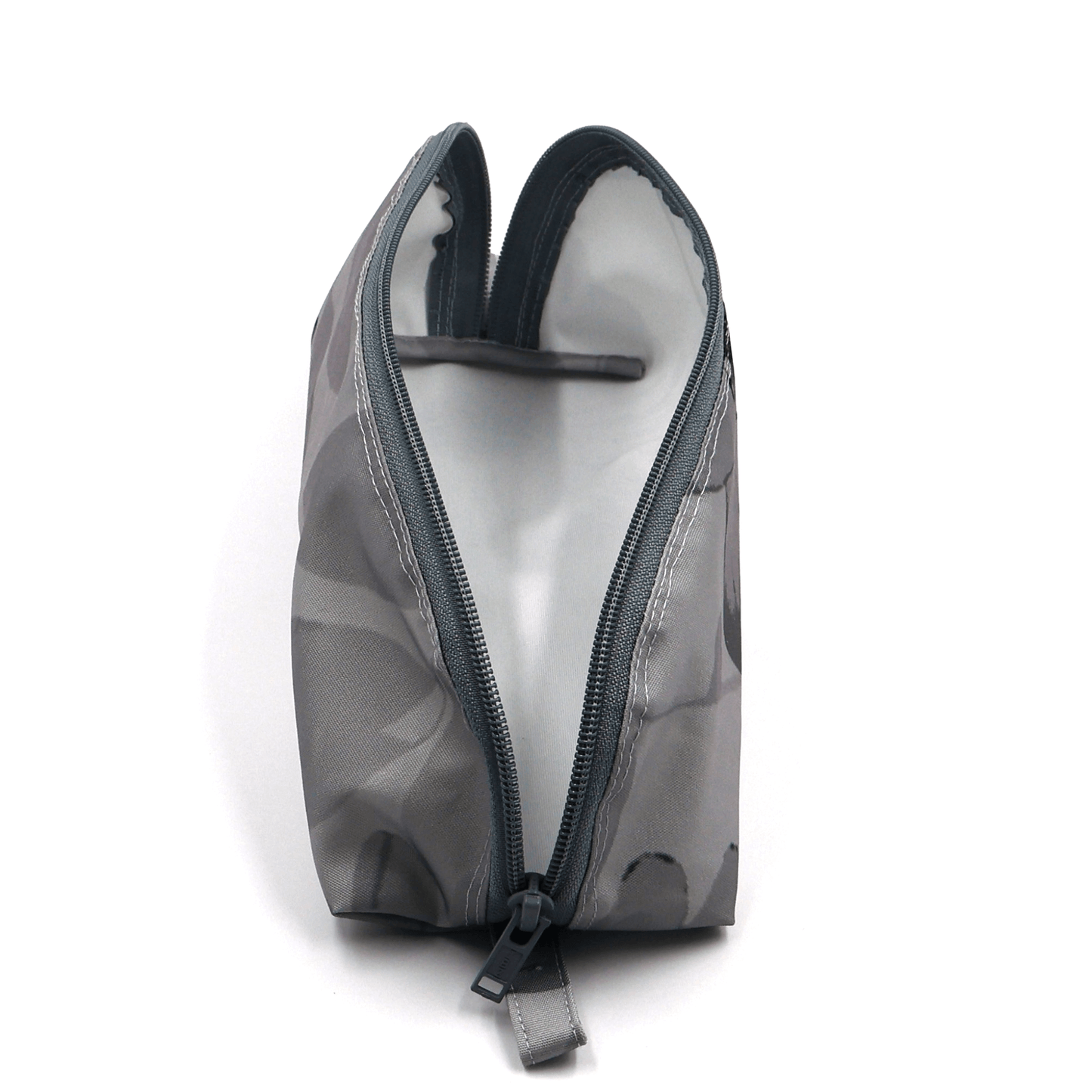 Pencil bag in soft and dark grey daisy floral design on light grey background. Open zipper.