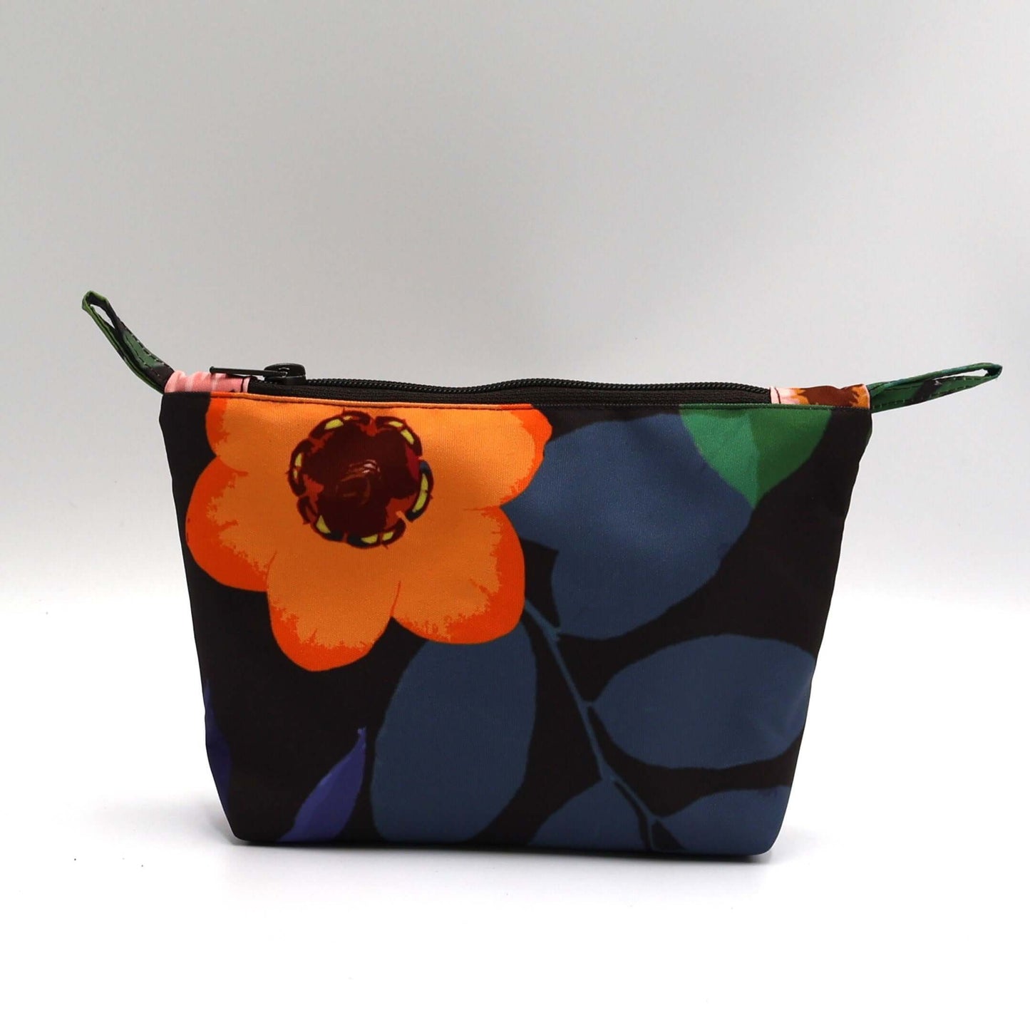 Dark brown/black makeup bag with colorful floral design, perfect for organizing beauty products.