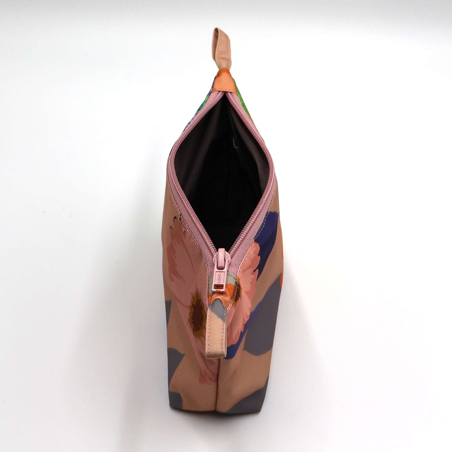 Peach daisy makeup bag, colorful floral design, perfect for organizing beauty products. Open zipper. Top view.