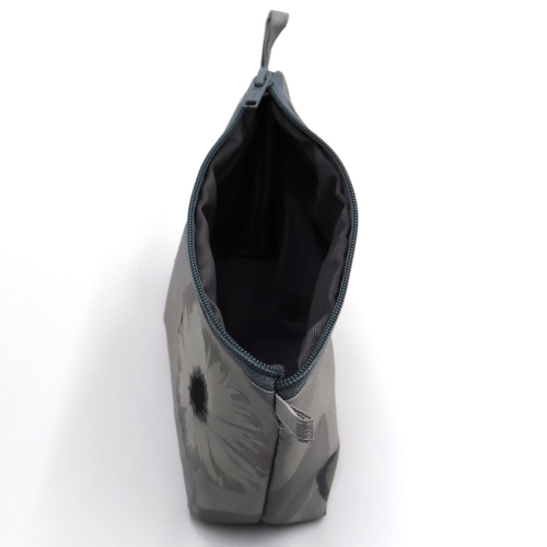 Dark and light grey floral makeup bag, zipped closure, perfect for organizing beauty products. Top open view.