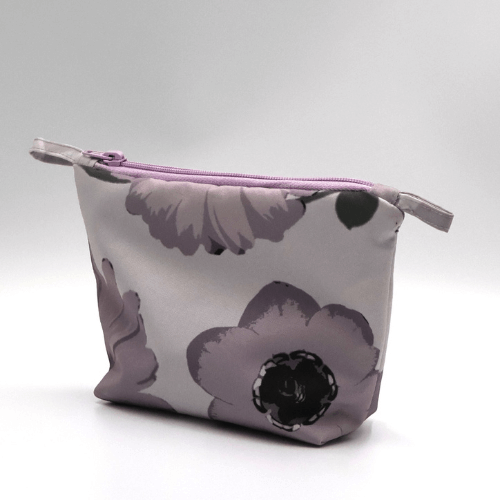 Ellie Bosch mauve floral makeup bag, zipped closure, perfect for organizing beauty products.