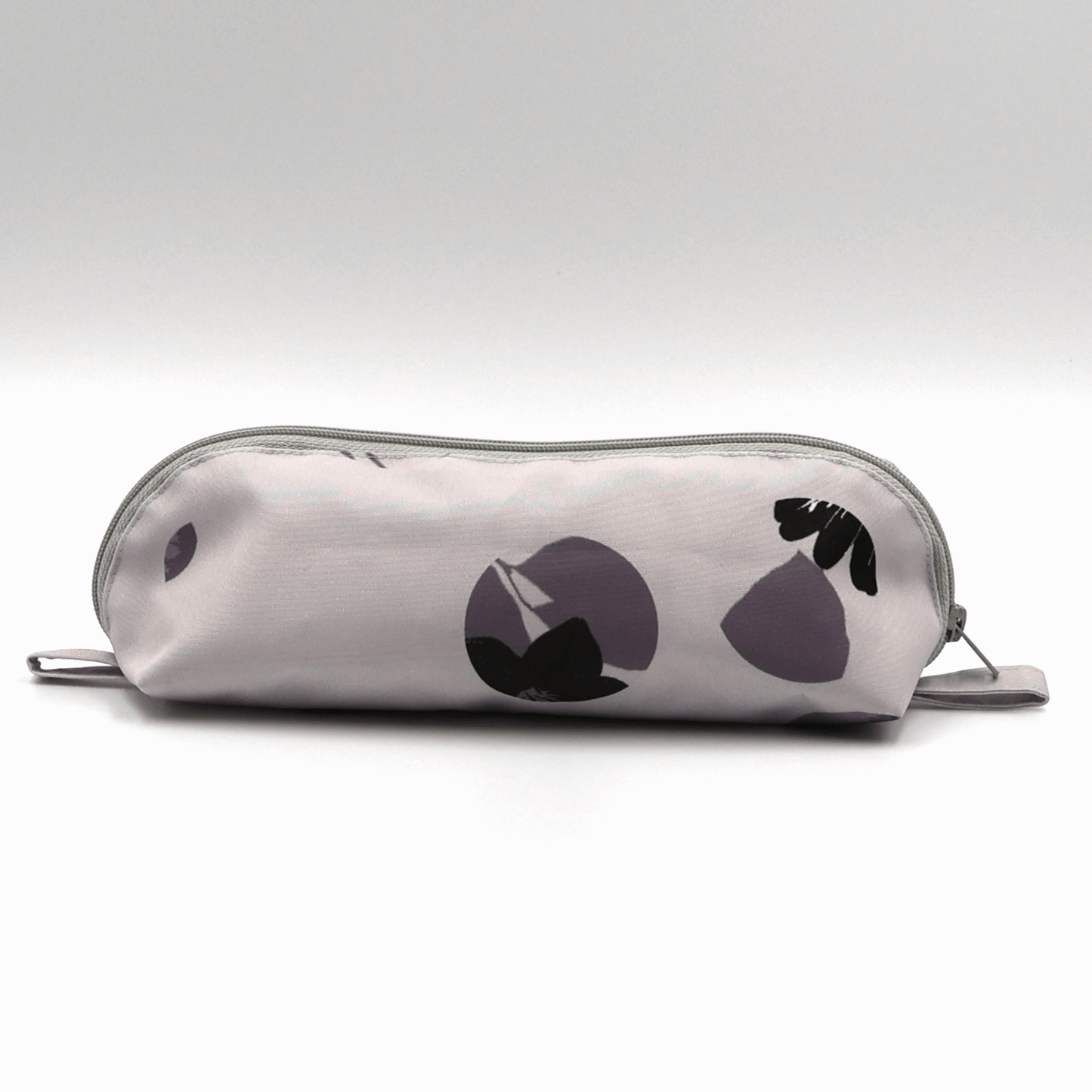Pencil bag in soft mauve and dark grey daisy floral design on dusky mauve background.