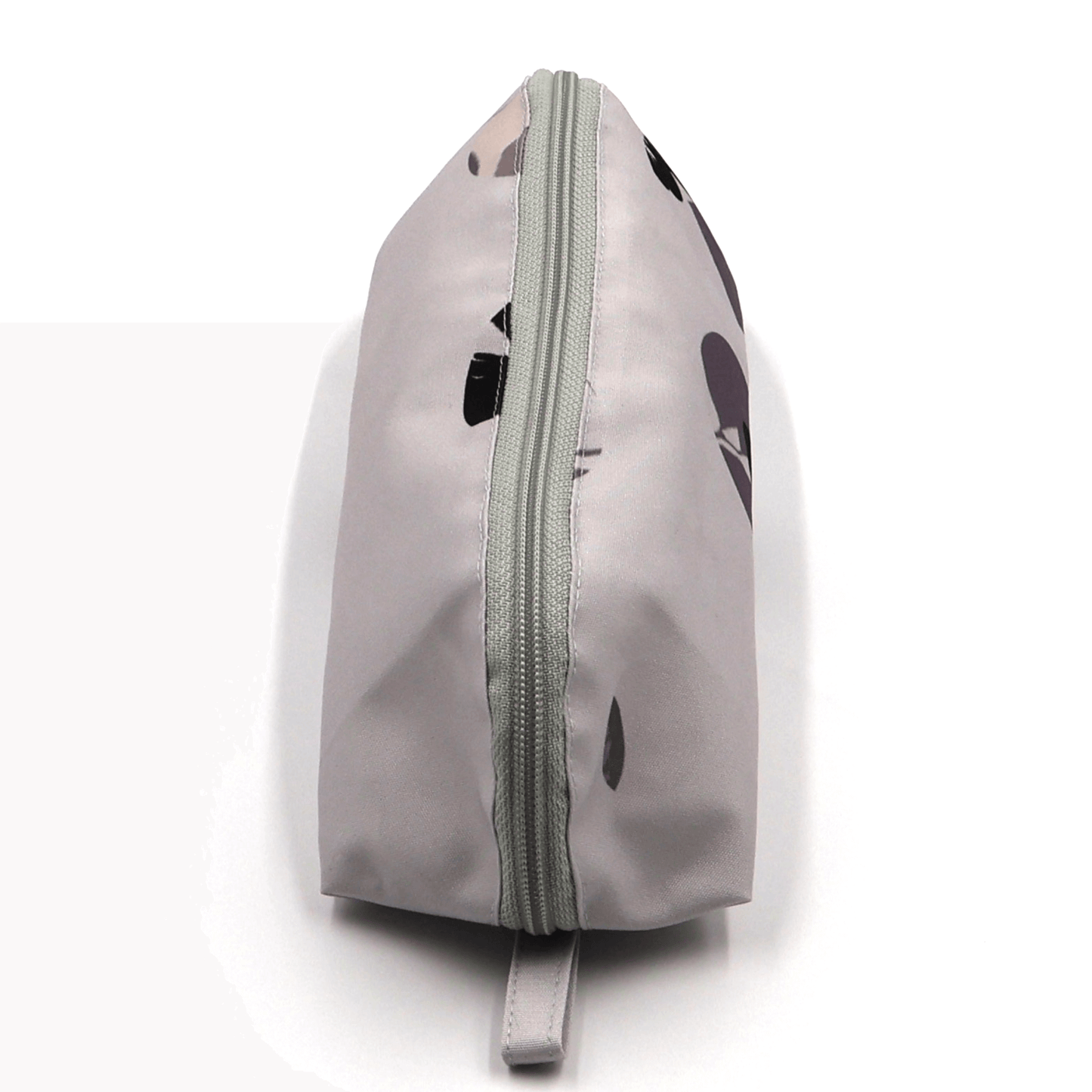 Pencil bag in soft mauve and dark grey daisy floral design on dusky mauve background. Top view.