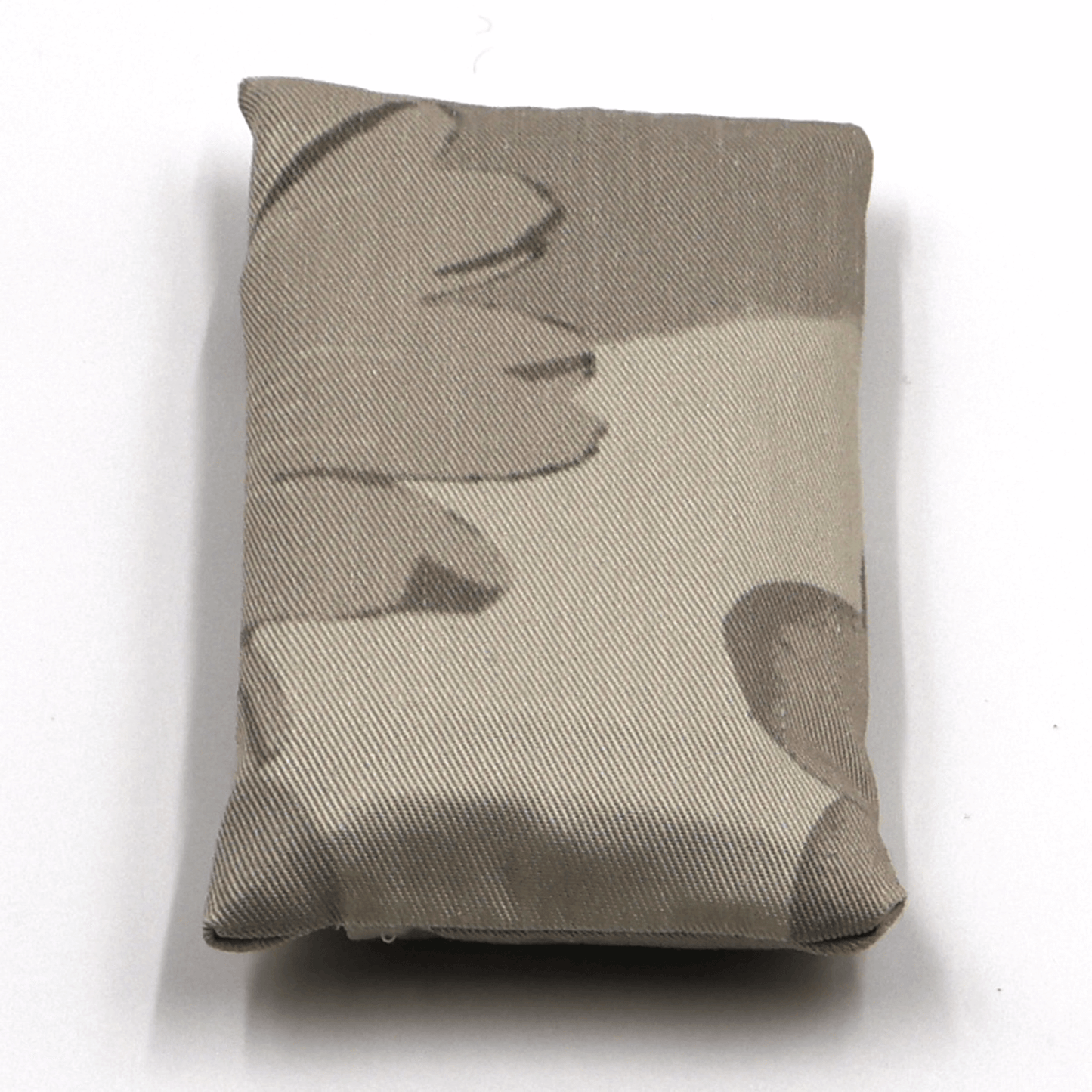 Fold up shopping bag with daisy floral design in dark and light beige and taupe.