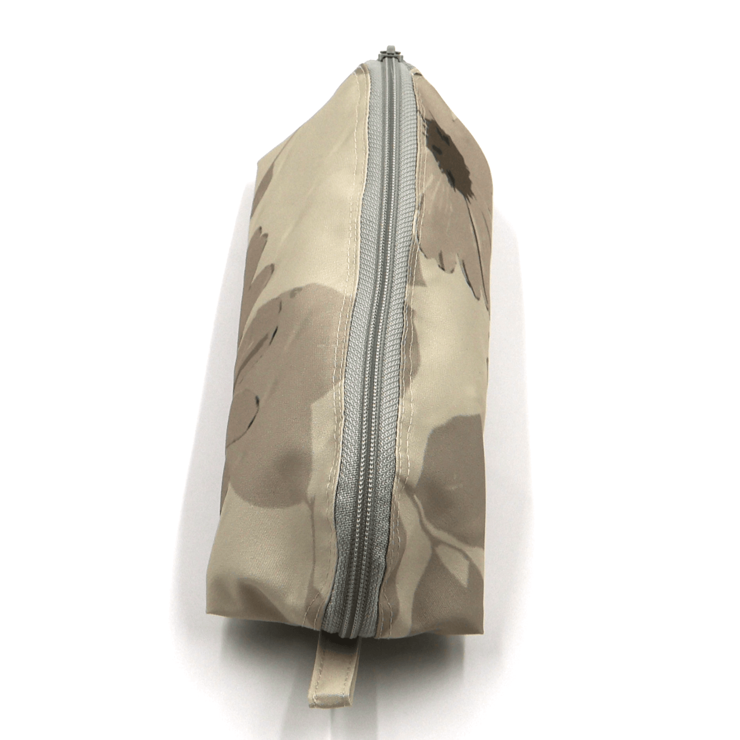 Pencil bag in beige and brown daisy floral design on soft ivory background. Top view. Closed zipper.