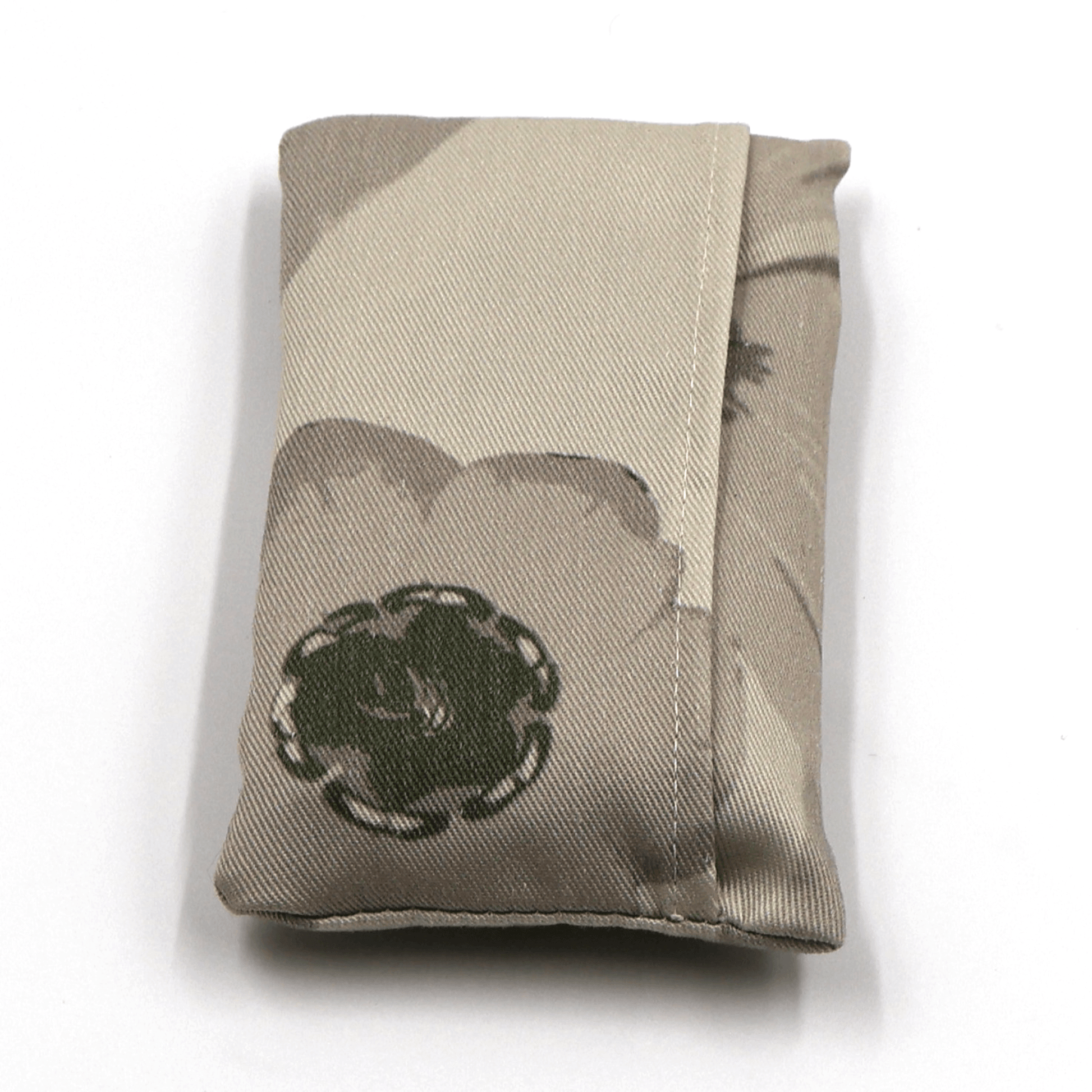 Fold up shopping bag with daisy floral design in dark and light beige and taupe. Fold view.