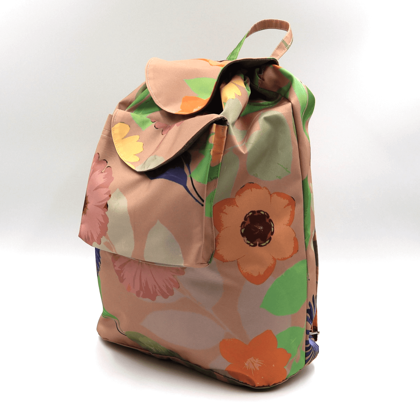 Lightweight backpack with drawstring and orange daisy floral design on dusky peach/orange background. Side view.