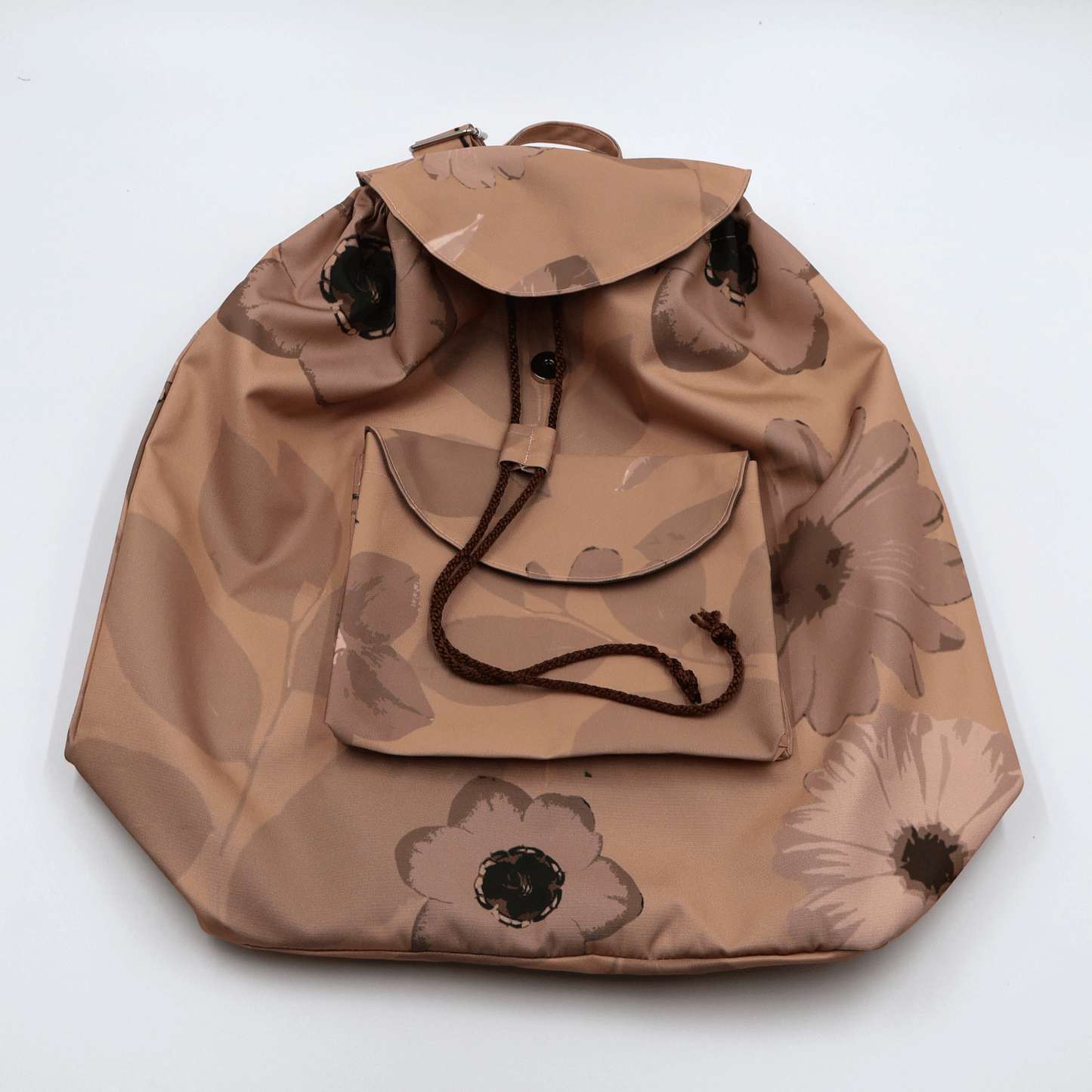 Lightweight backpack with drawstring and daisy floral design in dark and light rusty orange and peach. Flat view.