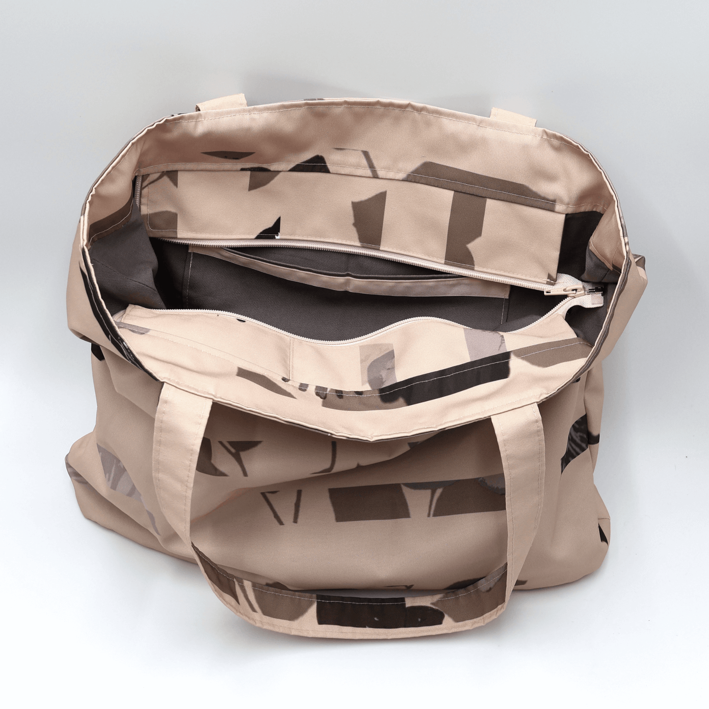 Shoulder bag with stripe/floral design in dusky peach and brown. Perfect for carrying books and documents. Inside view.