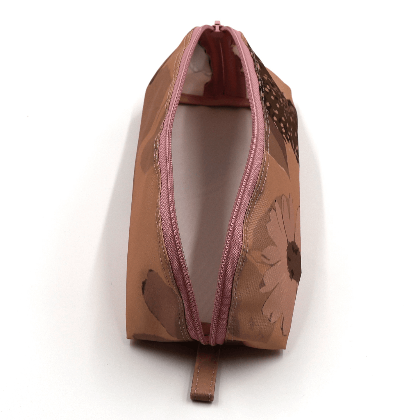 Pencil bag in rusty orange and brown daisy floral design on dusky orange background. Top view open.