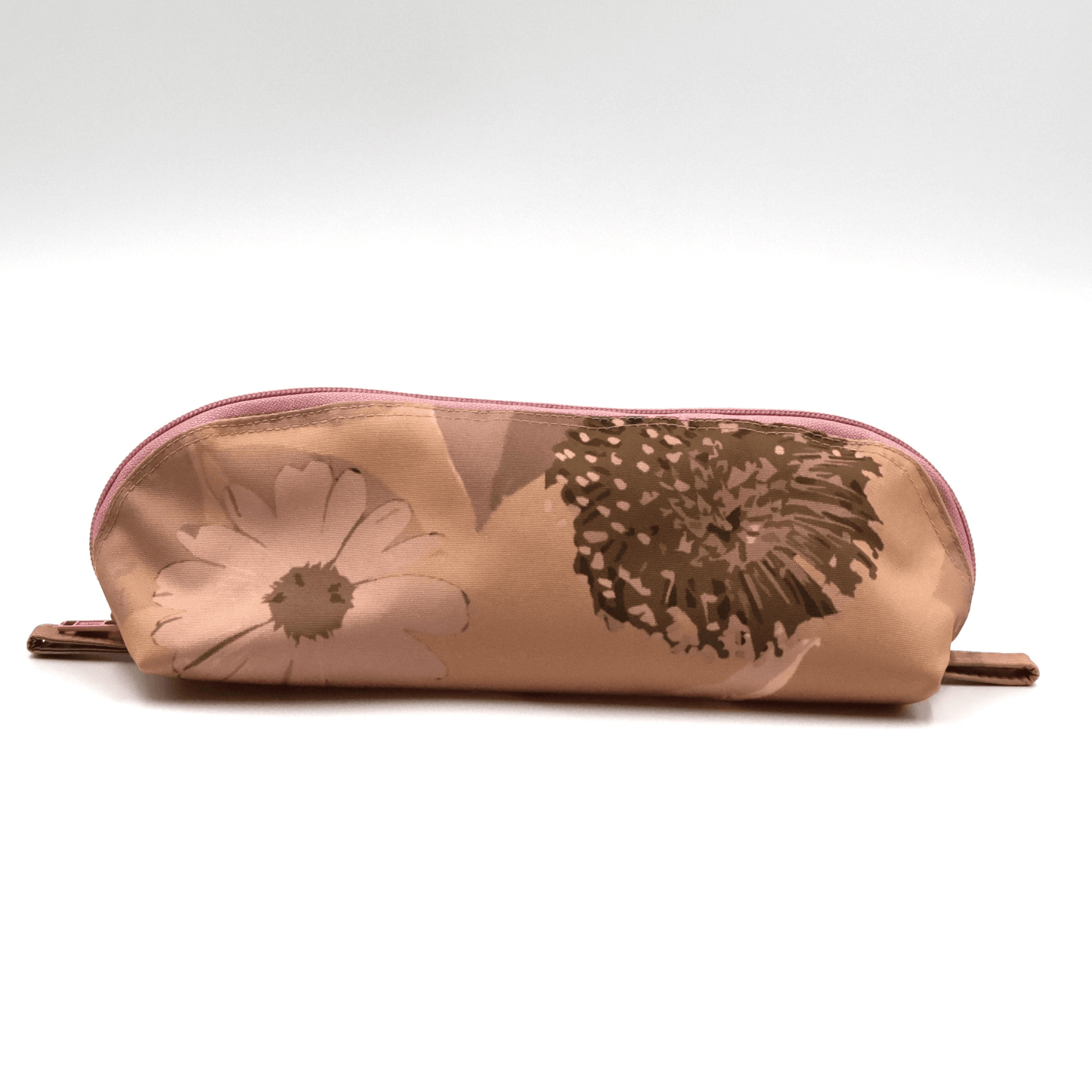 Pencil bag in rusty orange and brown daisy floral design on dusky orange background.