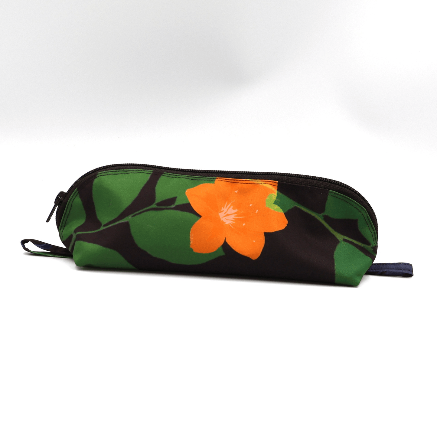 Pencil bag in bright colourful daisy floral design on dark brown/black background.