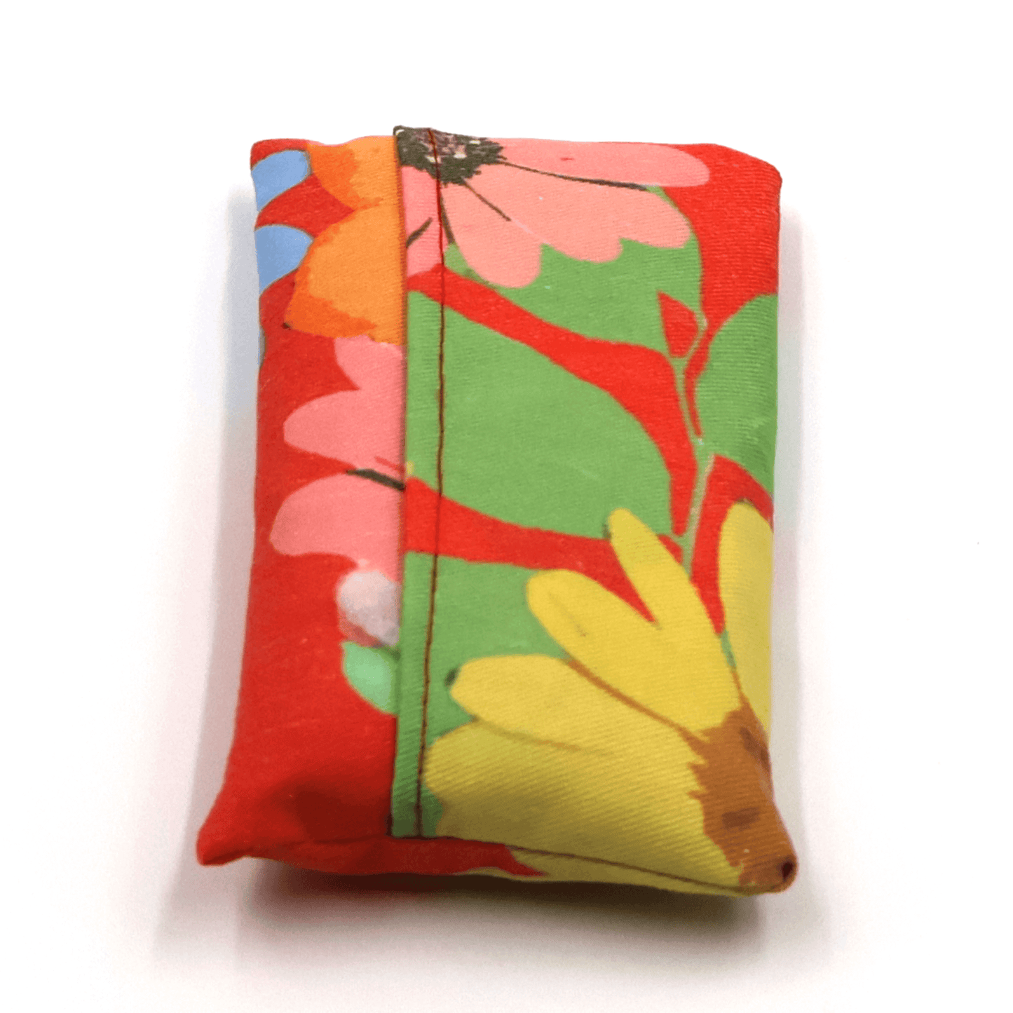 Fold up shopping bag in bright daisy floral design on red background