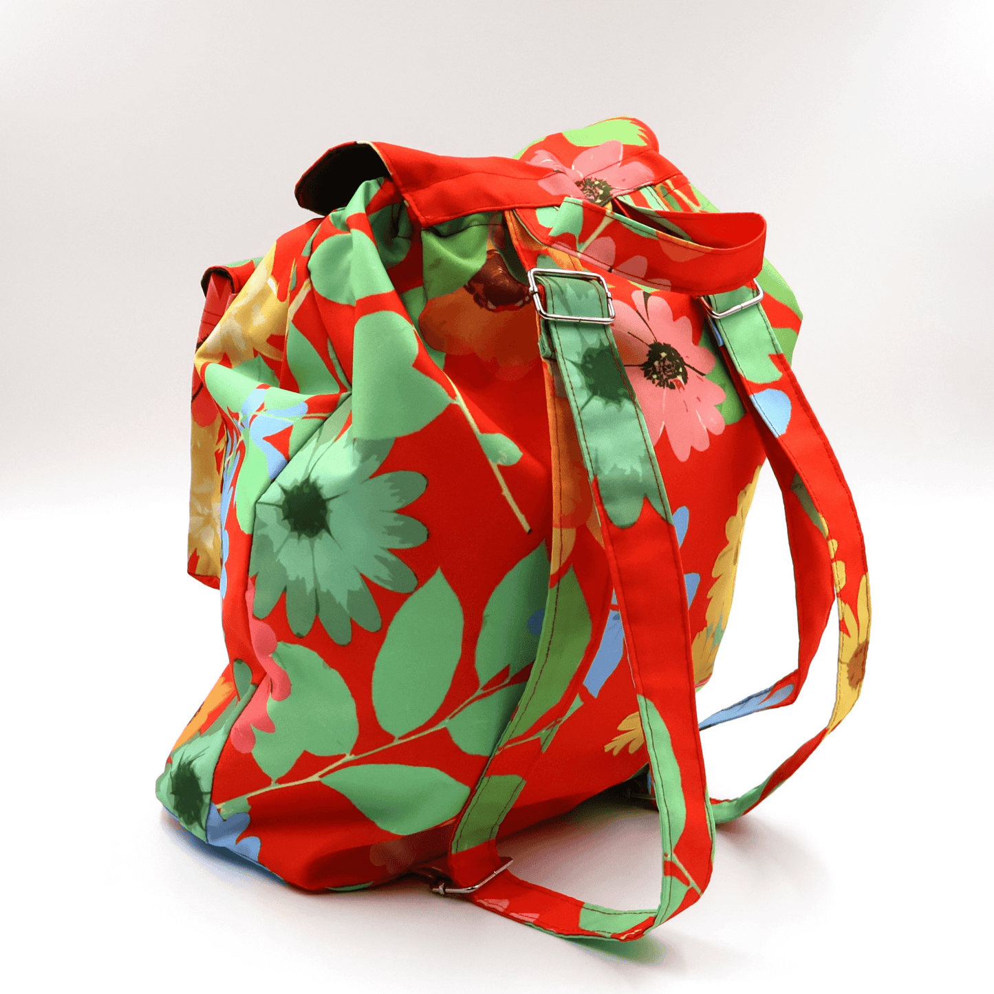 A lightweight, durable backpack with bright, colourful Daisy design on a red background. High-quality materials. Back view.