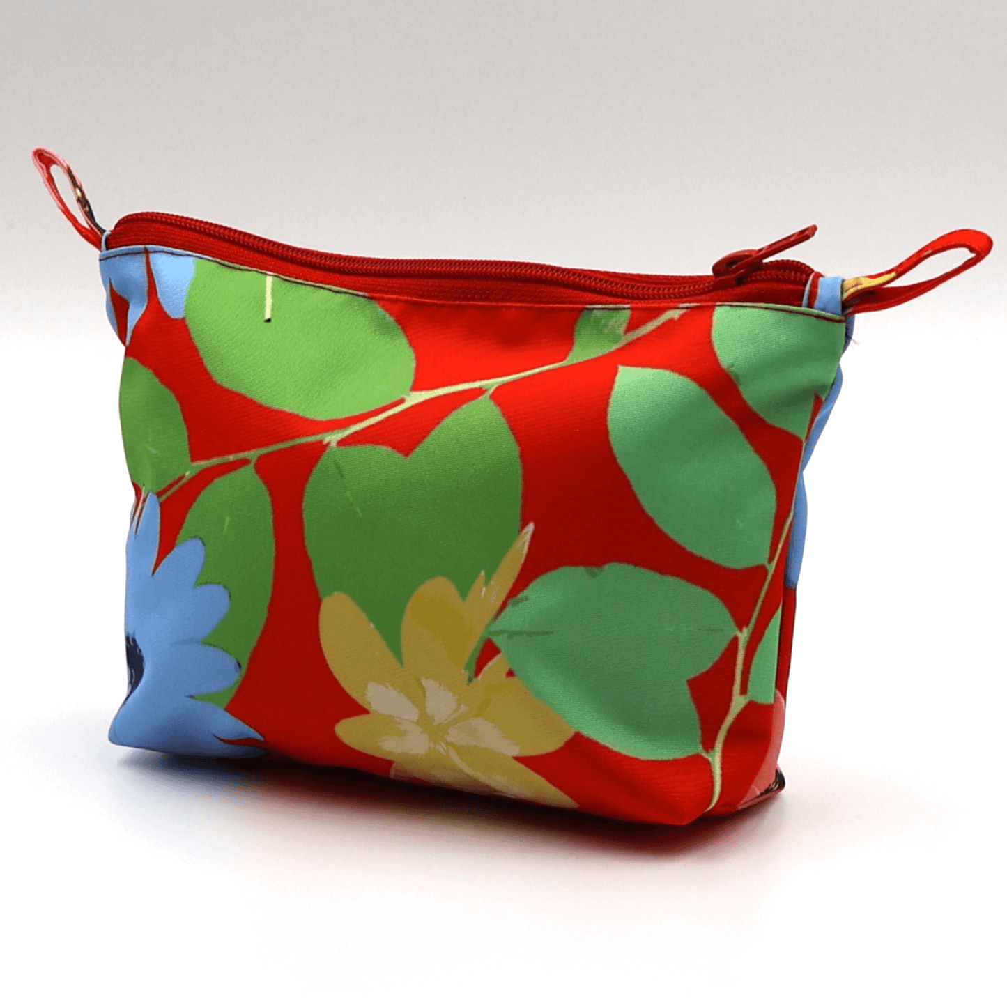 Colorful Ellie B Makeup Bag in red with floral design, zip closure, durable, lined, easy to clean.