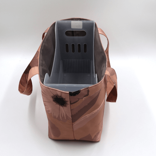 Medium teacher/book bag with daisy floral design in rusty orange, brown and dark peach. With plastic inner.