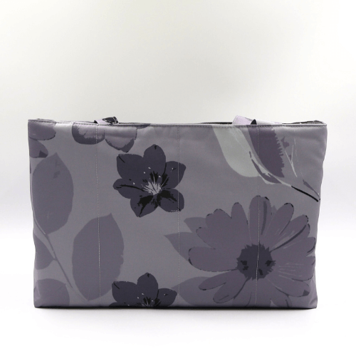 Teacher/book bag with floral daisy design in dark and light grey on a soft silver-grey background. Carry books and crafts.
