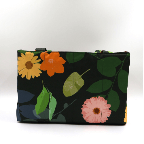 Large teacher/book bag with bright, daisy design on a black background. Carry books and crafts.