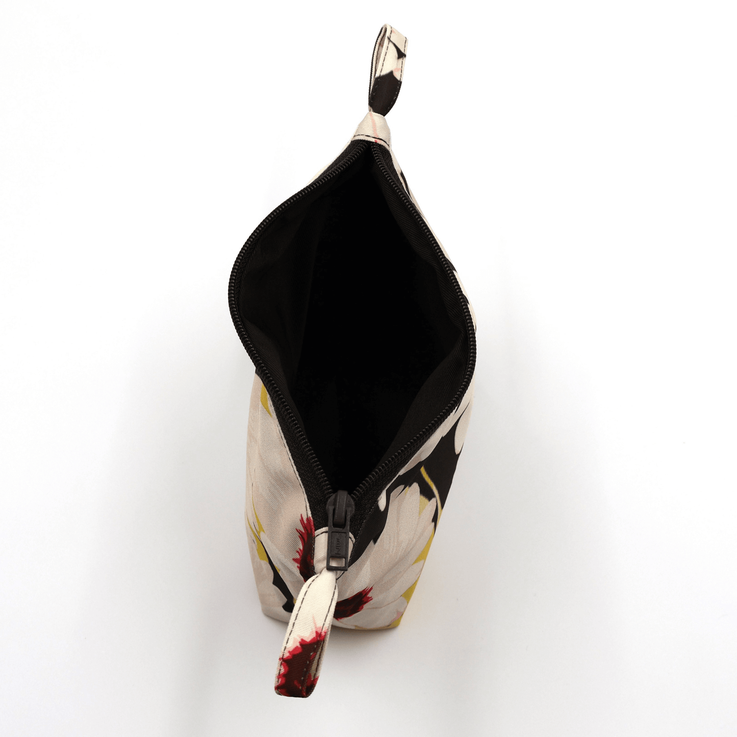 Top view of the Ellie B White Darling Makeup Bag, showcasing its zipped closure and stylish floral design.