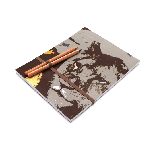 A4 Sketchpad with pencils and pencil holder with face of lion design on front cover.