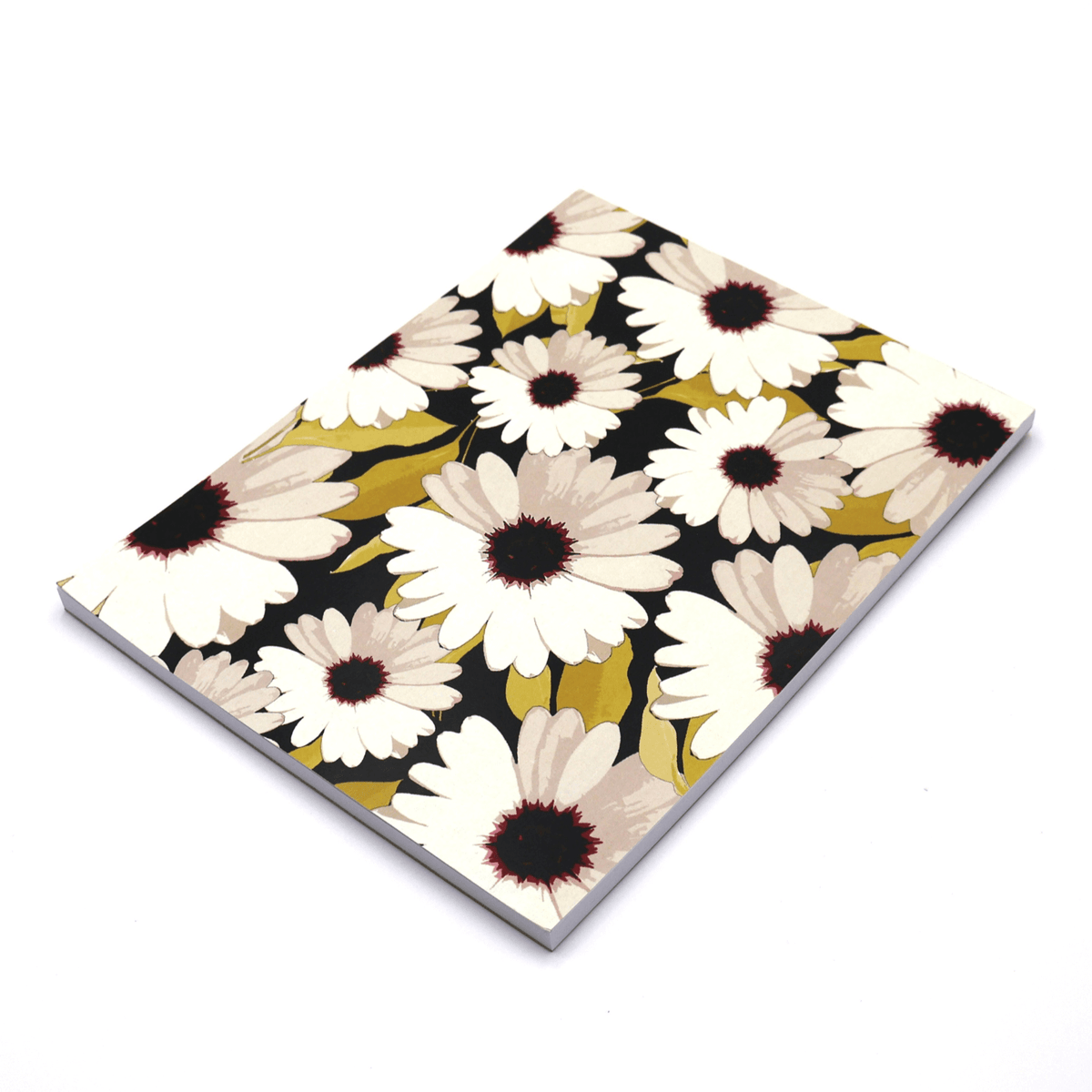 A4 blank notebook with a dramatic black background cover featuring a striking contrast print of white daisies and unique South African wildflowers.