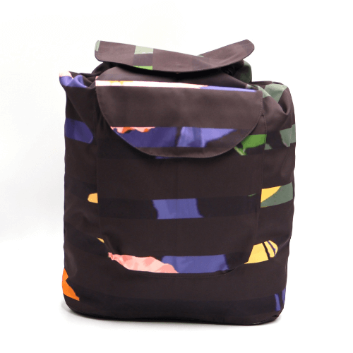 Lightweight backpack with drawstring and bright daisy floral and stripe design on dark brown/black background.