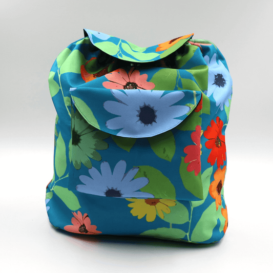 A lightweight, durable backpack with bright, colourful Daisy design on a blue background. High-quality materials.