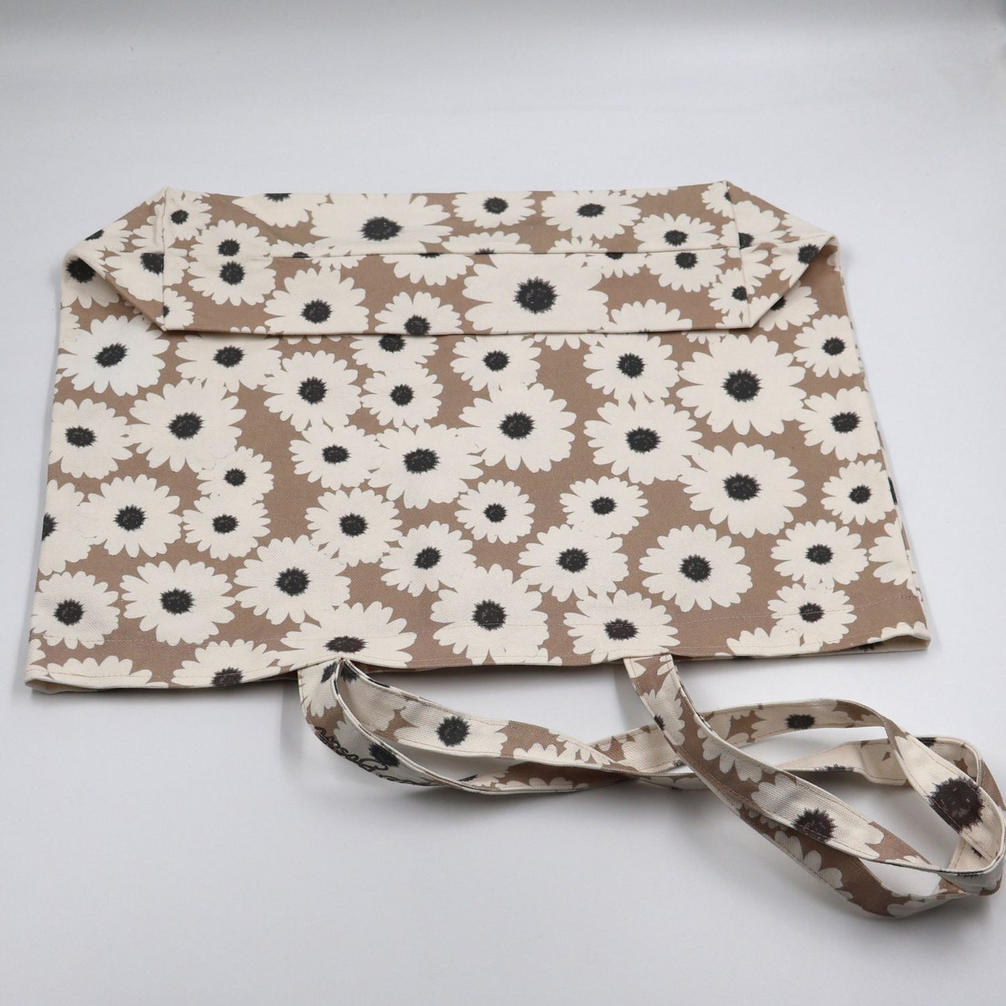 Close up view of quality stitching and finishes on Daisy Drift mushroom beige canvas tote bag